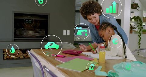 Helping child studying at home with parent tutoring over homework and sustainability icons