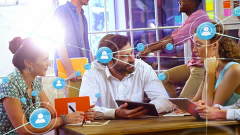 Diverse Team Engaging in Digital Networking at Office