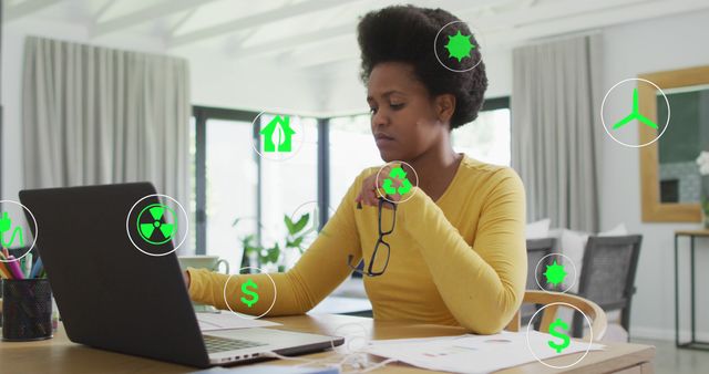 Woman Analyzing Sustainability Data on Laptop at Home Office - Download Free Stock Images Pikwizard.com