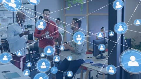 Digital Networking Discussion Among Diverse Colleagues in Modern Office