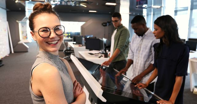 Smiling Businesswoman in Modern Collaborative Office Space with Diverse Colleagues - Download Free Stock Images Pikwizard.com