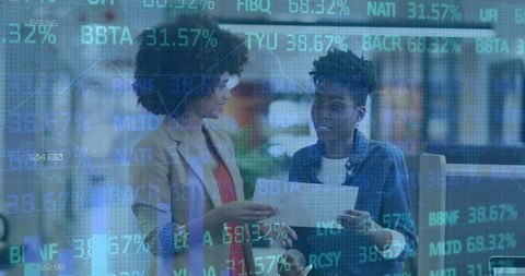 Diverse Businesswomen Analyzing Stock Market Reports