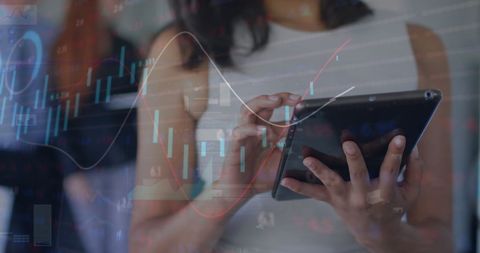 Businesswoman Analyzing Financial Data on Tablet with Graphic Overlay
