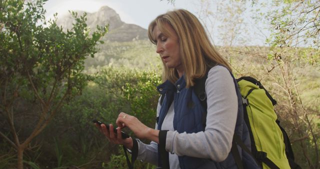 Senior Woman Enthusiastically Hiking in Mountain Scenery - Download Free Stock Images Pikwizard.com