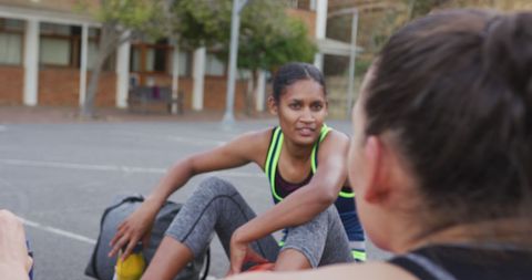 diverse female basketball team taking break outdoors - Download Free Stock Images Pikwizard.com