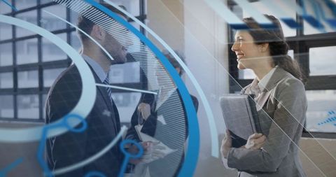 Businesswoman smiling while holding tablet and networking through blue tech glass decals