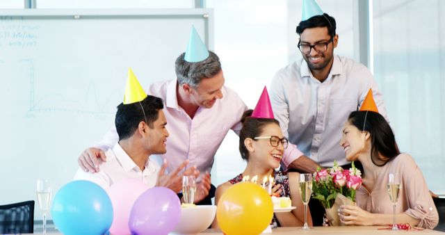 Executives celebrating a colleague birthday in office - Download Free Stock Photos Pikwizard.com