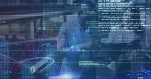 Innovative Team Analyzing Financial Data in High-Tech Environment