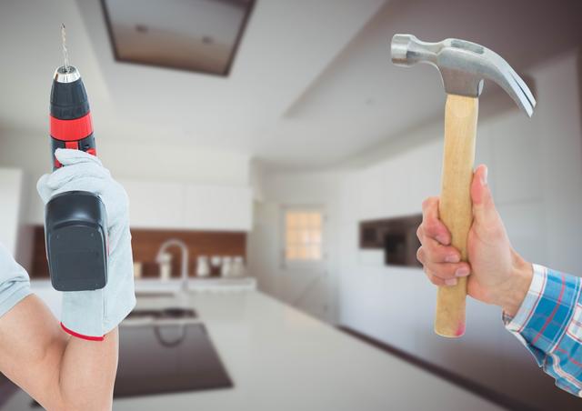 Hands holding a drill and a hammer in a modern kitchen environment. Useful for depicting home renovation concepts, DIY projects, and tool-related content. This image could be used in marketing materials for hardware stores, DIY blogs, instructional guides, or home improvement campaigns.