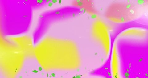 Psychedelic neon gradient background with magenta pink and yellow glow and green flecks