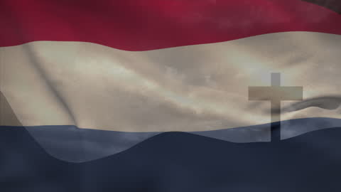 Wooden Cross and Mountains Overlaid with Dutch Flag