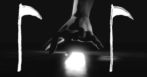 Dark Silhouette of Hand with Scythes in Mysterious Lighting