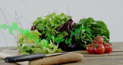Fresh produce and financial charts concept on kitchen table