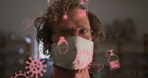 Man in Pottery Studio Wears a Face Mask with COVID-19 Symbols Overlay - Download Free Stock Images Pikwizard.com