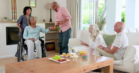 Senior Friends Sharing Snacks and Conversations in Cozy Home