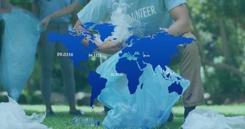 Volunteers Collecting Plastic Bottles in Park for Global Cleanup