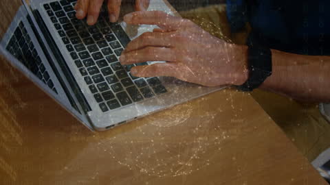 Man Typing on Laptop with Abstract Global Data Overlay