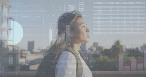 Businesswoman Analyzing Financial Data, Urban Backdrop