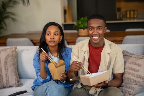Couple Enjoying Takeout at Home, Comfortable Atmosphere, Contemporary Lifestyle