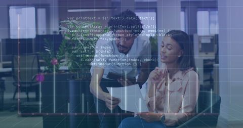 Diverse coworkers analyzing reports in office with code overlay
