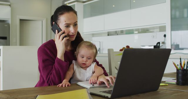 Multitasking Mother Working from Home with Baby on Lap - Download Free Stock Images Pikwizard.com