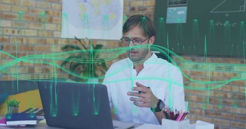 Data Analyst Presenting Interactive Green Waveform Visualization While Working on Laptop