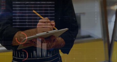 Chef analyzing business data in modern kitchen environment