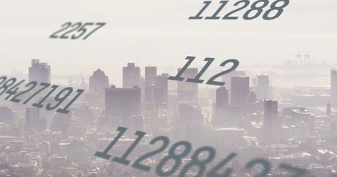 Financial data processing over hazy cityscape