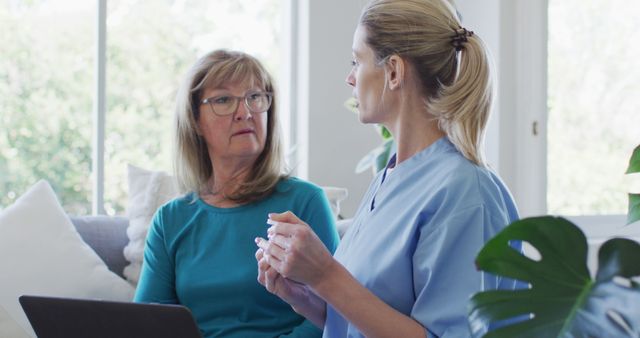 Nurse consulting senior woman at home - Download Free Stock Images Pikwizard.com