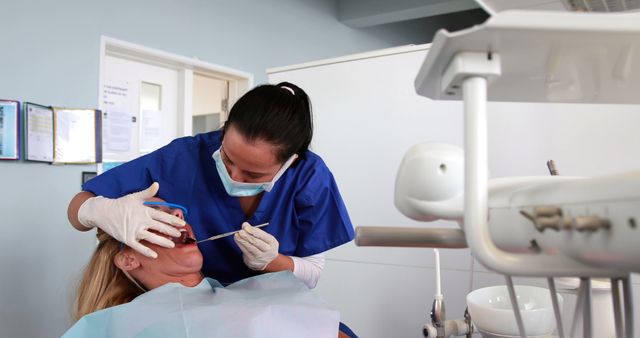 Dentist Examining Patient with Dental Tools in Modern Clinic - Download Free Stock Images Pikwizard.com