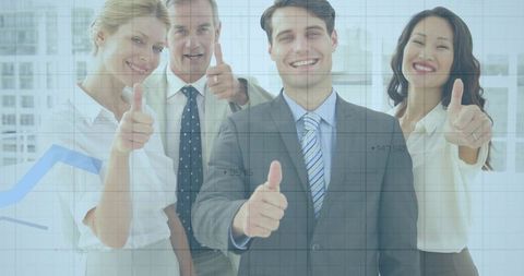 Smiling corporate team giving thumbs-up in modern office with blue growth chart overlay