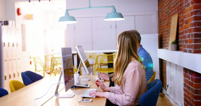 Coworkers Collaborating in Modern Office with Exposed Brick Wall - Download Free Stock Images Pikwizard.com