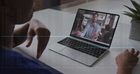 Business Person Engaged in Virtual Meeting on Laptop Screen at Home Office