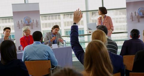 Business Seminar Speaker Engaging with Diverse Audience - Download Free Stock Images Pikwizard.com