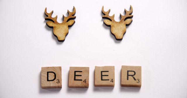 Minimalist Wooden Deer Sculptures with Scrabble Letters - Download Free Stock Images Pikwizard.com