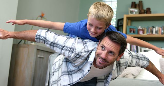 Father and Son Playing Airplane Game Indoors - Download Free Stock Images Pikwizard.com