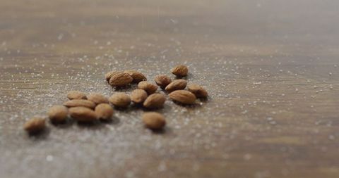 Scattered Almonds on Rustic Wooden Table Surface - Download Free Stock Images Pikwizard.com