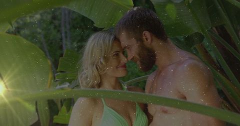 Couple sharing romantic moment in tropical garden paradise