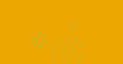 Green fireworks on vibrant orange background