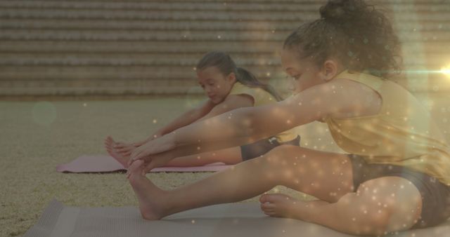 Young Girls Stretching Together During Outdoor Exercise Class - Download Free Stock Images Pikwizard.com