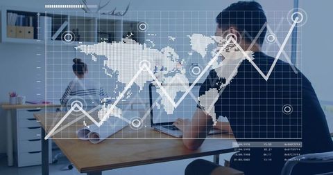 Man typing on laptop at office desk with global analytics overlay and rising graph