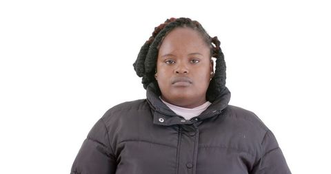 Contemplative African American Woman in Winter Coat