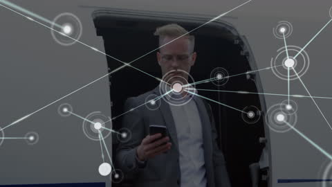 Businessman Interacting with Digital Network Interface at Airport