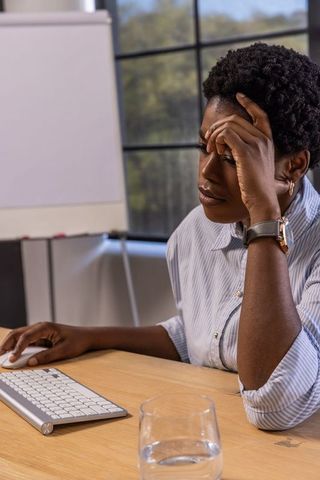 African American Woman Working in Modern Office Environment