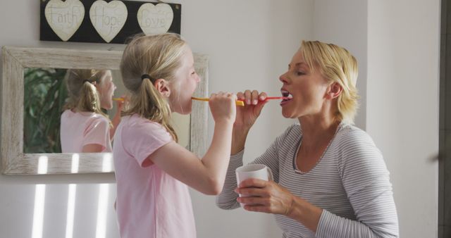 Mother and Daughter Brushing Teeth for Oral Hygiene Routine - Download Free Stock Images Pikwizard.com