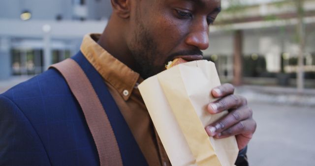 Man Eating Sandwich Outdoors During Lunch Break - Download Free Stock Images Pikwizard.com