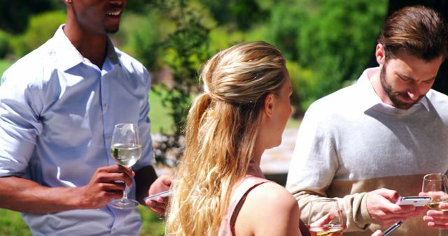 Casual Outdoor Gathering People Chatting Wine Glasses - Download Free Stock Images Pikwizard.com