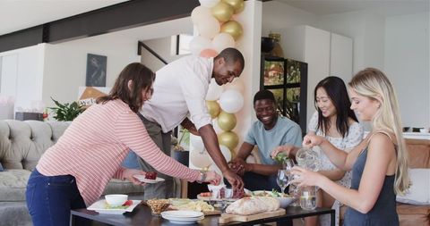 Diverse Friends Sharing Joyful Housewarming Gathering