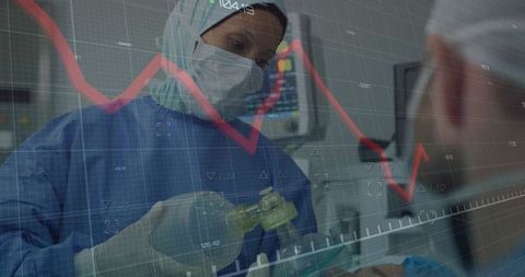 Medical professional uses ambu bag while vital sign trends overlay