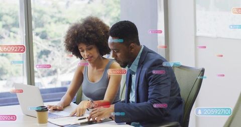 Collaborating over documents with augmented reality tags in sunlit modern office meeting